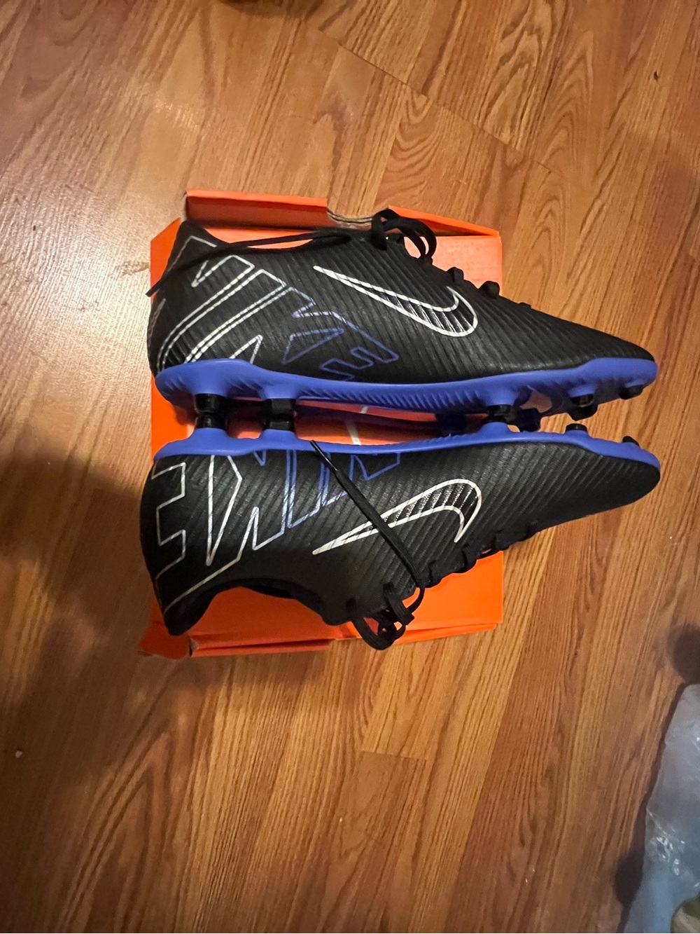 Nike Men's Black Soccer Cleats with Blue Sole Accents